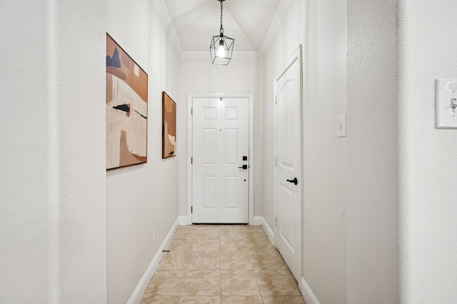 doorway to outside featuring ornamental molding, baseboards, and light tile patterned floors