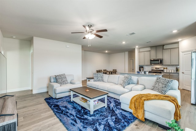 7332 Carnation St, Little Elm, TX 76227 - living room with light wood-type flooring, ceiling fan, recessed lighting, and baseboards