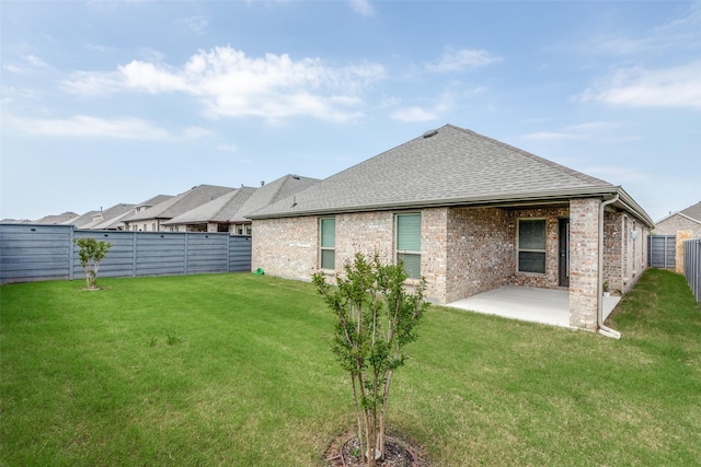 7332 Carnation St, Little Elm, TX 76227 - back of house featuring a patio, a shingled roof, and brick siding