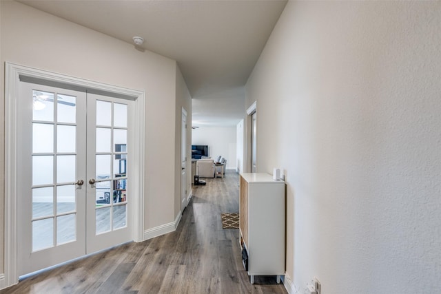 7332 Carnation St, Little Elm, TX 76227 - corridor with french doors, wood finished floors, plenty of natural light, and baseboards