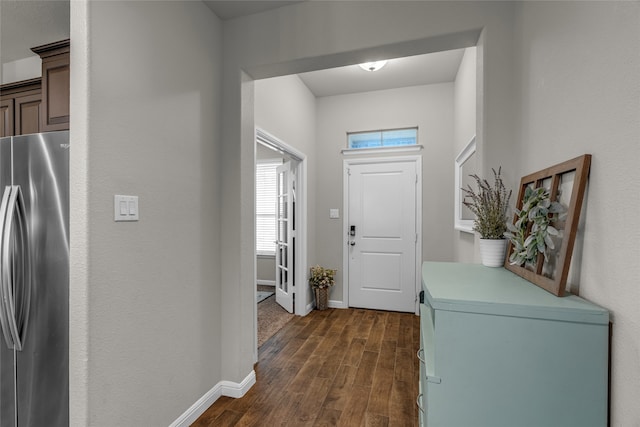411 Skipper Ln, Azle, TX 76020 - entrance foyer with dark wood-type flooring and baseboards