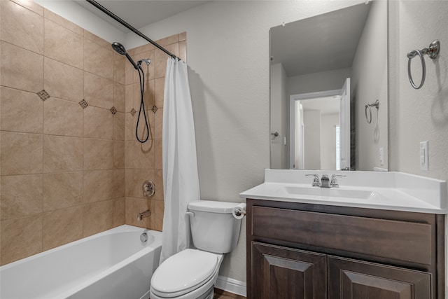 411 Skipper Ln, Azle, TX 76020 - bathroom featuring shower / tub combo, toilet, vanity, and a textured wall