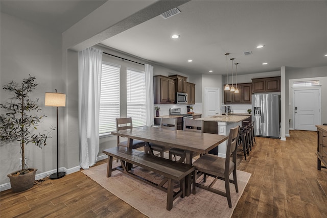 411 Skipper Ln, Azle, TX 76020 - dining space featuring light wood-style floors, recessed lighting, and baseboards