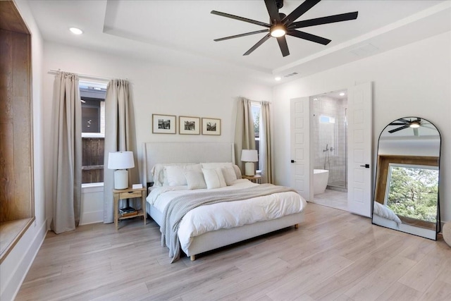bedroom featuring light wood-style flooring, recessed lighting, ensuite bathroom, and ceiling fan