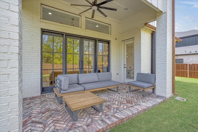 view of patio / terrace featuring french doors, ceiling fan, and an outdoor living space