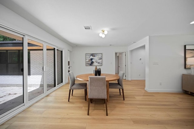 1500 W Virginia St, Mckinney, TX 75069 - dining room featuring light wood-type flooring and baseboards