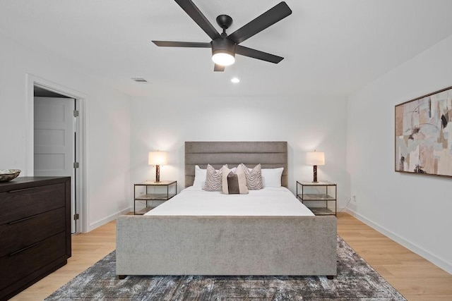 1500 W Virginia St, Mckinney, TX 75069 - bedroom featuring wood finished floors, baseboards, a ceiling fan, and recessed lighting
