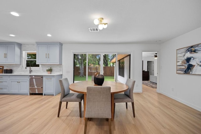 1500 W Virginia St, Mckinney, TX 75069 - dining room with healthy amount of natural light, light wood-type flooring, recessed lighting, and baseboards