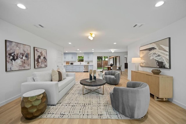 1500 W Virginia St, Mckinney, TX 75069 - living area with light wood-style floors, recessed lighting, and baseboards