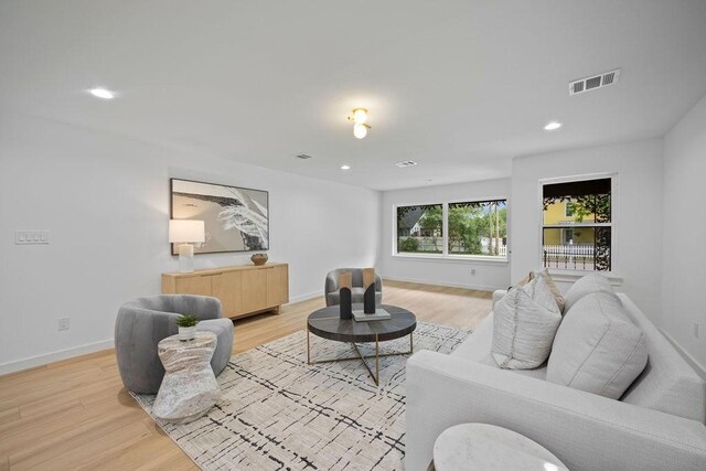 1500 W Virginia St, Mckinney, TX 75069 - living room with light wood-style flooring, baseboards, and recessed lighting