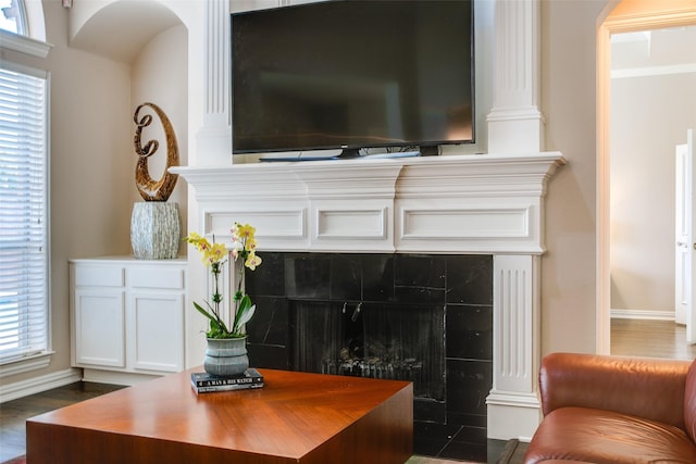 6513 Crawley Dr, Plano, TX 75093 - living room featuring a tile fireplace, plenty of natural light, and baseboards