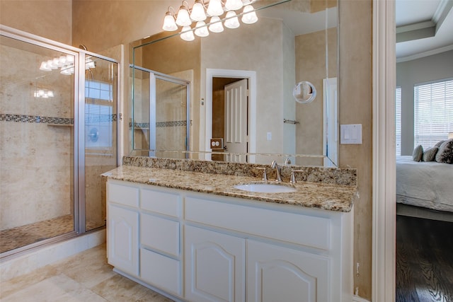 6513 Crawley Dr, Plano, TX 75093 - ensuite bathroom with ornamental molding, a stall shower, and vanity