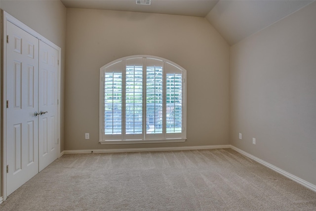 6513 Crawley Dr, Plano, TX 75093 - unfurnished bedroom with carpet floors, baseboards, and vaulted ceiling