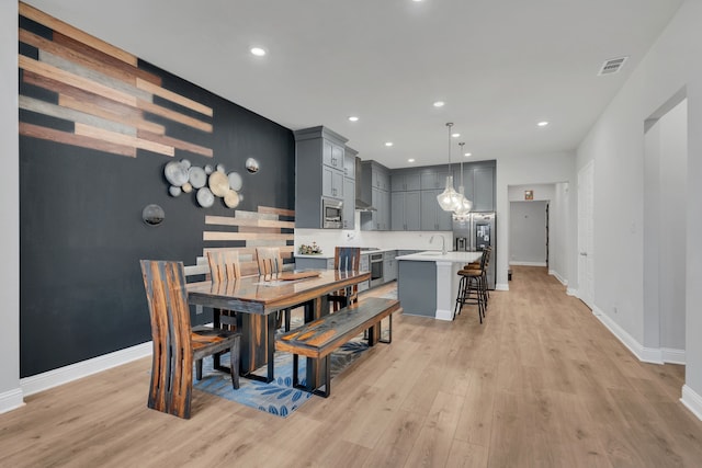 4533 Wilbarger St, Plano, TX 75024 - dining room with light wood-type flooring, baseboards, and recessed lighting