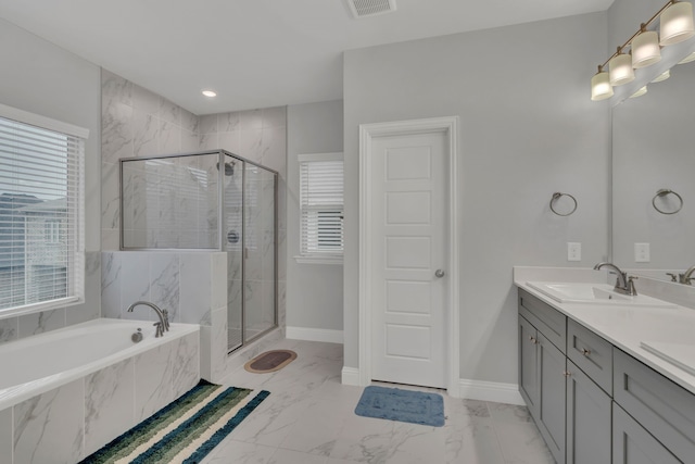4533 Wilbarger St, Plano, TX 75024 - full bathroom featuring a garden tub, healthy amount of natural light, double vanity, and a stall shower
