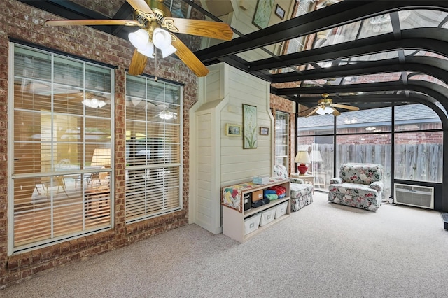 sunroom / solarium featuring a ceiling fan, a wall unit AC, and area for grilling