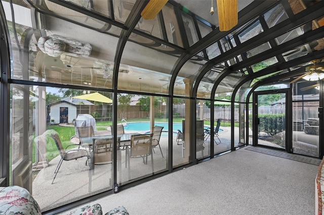 sunroom with outdoor dining area