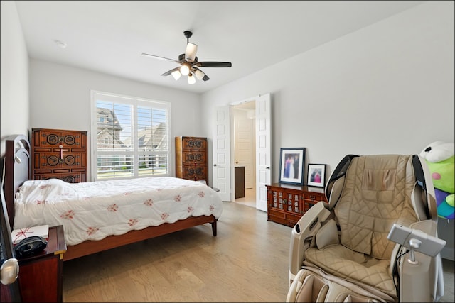 8529 Melrose, The Colony, TX 75056 - bedroom featuring light wood finished floors and a ceiling fan