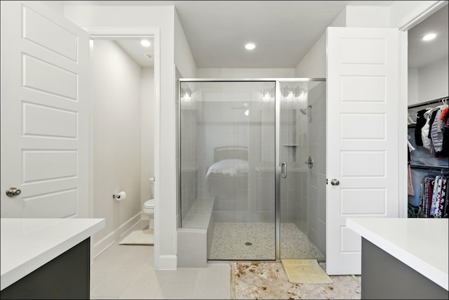8529 Melrose, The Colony, TX 75056 - bathroom featuring vanity, a shower stall, toilet, baseboards, and recessed lighting