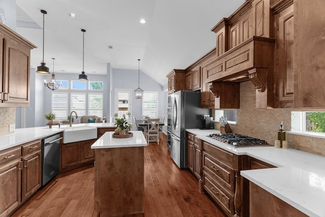 700 Renault Way, Mckinney, TX 75071 - kitchen with a sink, appliances with stainless steel finishes, dark wood-style flooring, decorative backsplash, and lofted ceiling