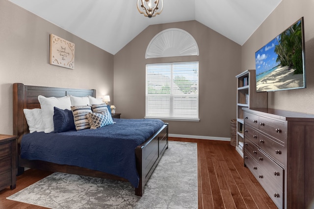 700 Renault Way, Mckinney, TX 75071 - bedroom featuring dark wood-style flooring, lofted ceiling, and baseboards