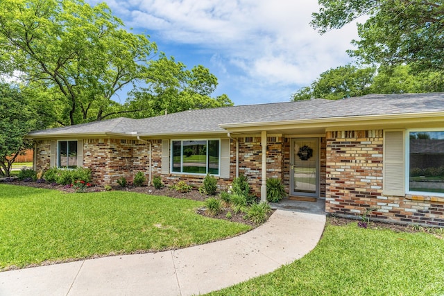 2029 Westridge Dr, Plano, TX 75075 - ranch-style house with brick siding, a front lawn, and a shingled roof