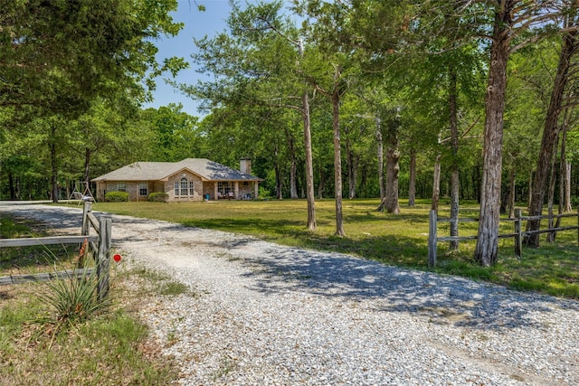 4942 US Highway 69, Denison, TX 75021 - view of front of property featuring gravel driveway and a chimney