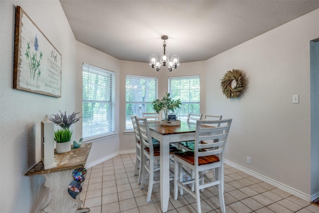 4942 US Highway 69, Denison, TX 75021 - dining room with a chandelier, light tile patterned floors, and baseboards