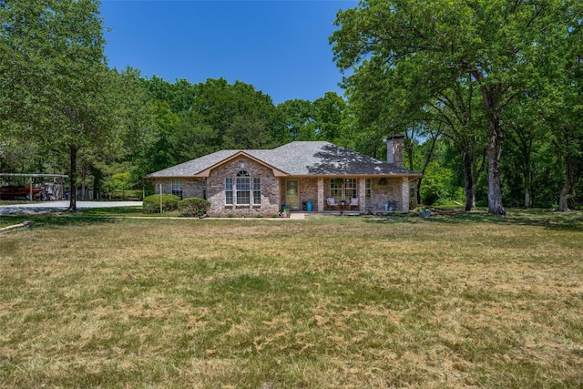 4942 US Highway 69, Denison, TX 75021 - ranch-style home featuring a chimney and a front lawn