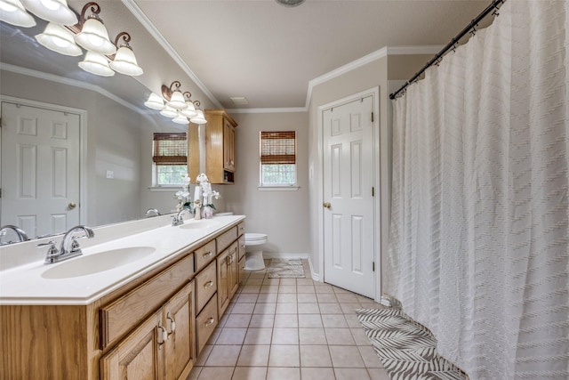 4942 US Highway 69, Denison, TX 75021 - full bathroom featuring tile patterned floors, double vanity, ornamental molding, toilet, and baseboards