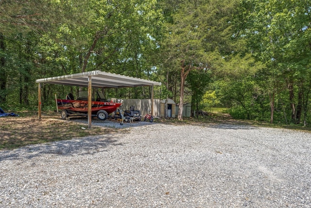 4942 US Highway 69, Denison, TX 75021 - view of car parking featuring a detached carport, a shed, and gravel driveway