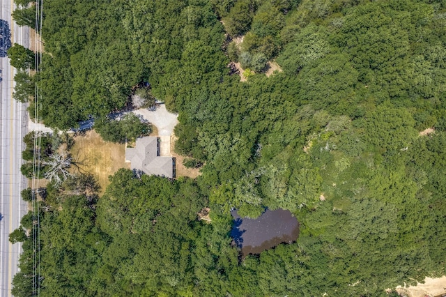 4942 US Highway 69, Denison, TX 75021 - aerial view of property and surrounding area featuring a heavily wooded area