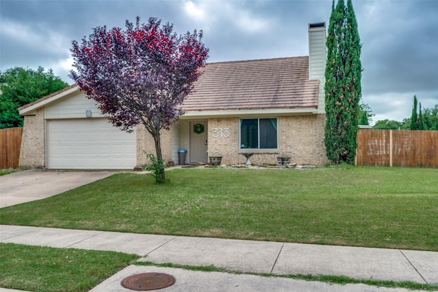 view of front of property with concrete driveway, brick siding, an attached garage, and a chimney