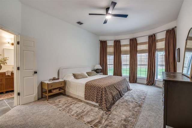 6520 Creek Crossing Ln, Sachse, TX 75048 - bedroom featuring carpet floors, connected bathroom, and a ceiling fan