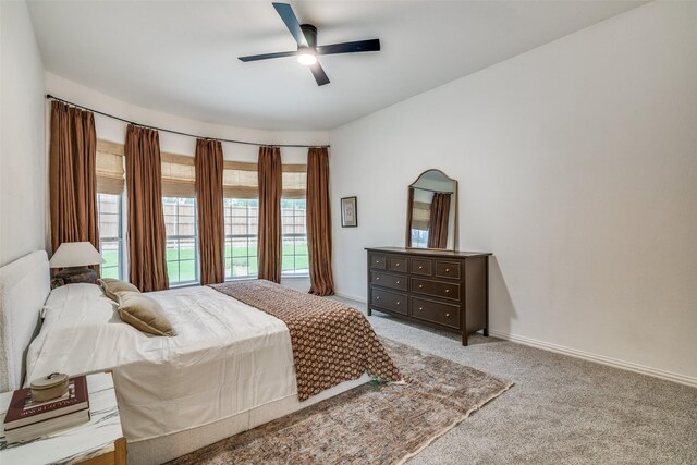 6520 Creek Crossing Ln, Sachse, TX 75048 - bedroom with carpet flooring, baseboards, and a ceiling fan