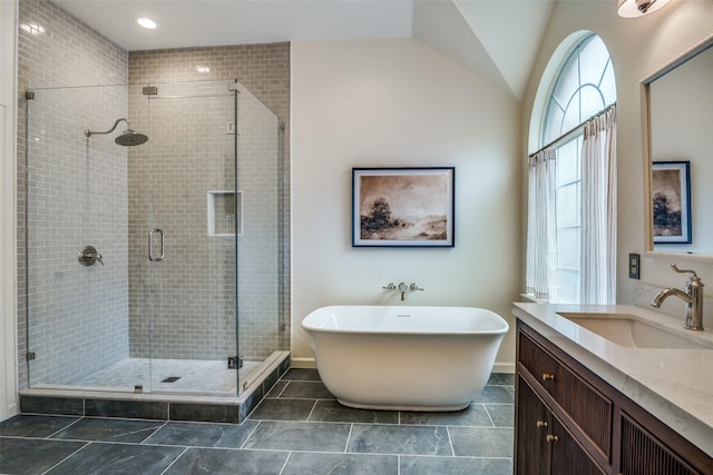 6520 Creek Crossing Ln, Sachse, TX 75048 - full bathroom with a stall shower, vanity, a soaking tub, and vaulted ceiling