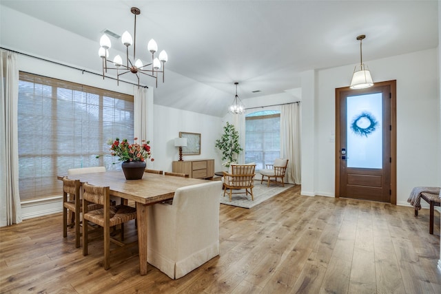 6520 Creek Crossing Ln, Sachse, TX 75048 - dining room featuring a chandelier, light wood-style flooring, and baseboards
