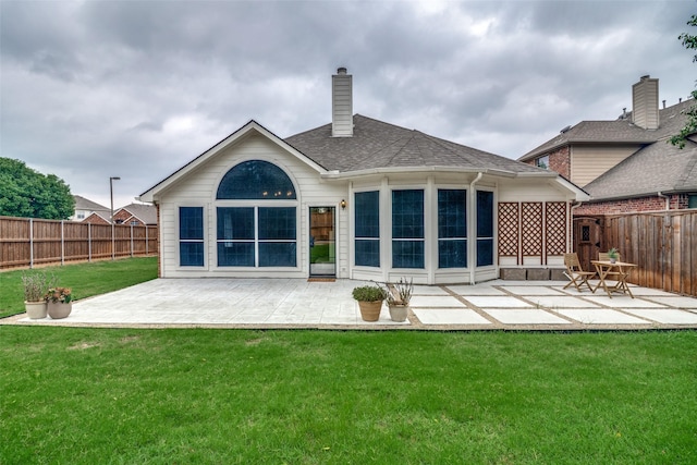 6520 Creek Crossing Ln, Sachse, TX 75048 - rear view of property with a patio area and a shingled roof