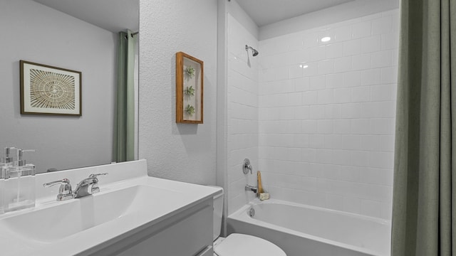 1612 Cansler Dr, Denton, TX 76249 - bathroom featuring bathtub / shower combination, a textured wall, toilet, and vanity