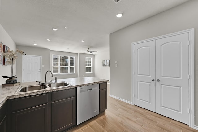 2867 Baneberry Ln, Mesquite, TX 75150 - kitchen with stainless steel appliances, dark brown cabinets, tasteful backsplash, light stone countertops, and recessed lighting