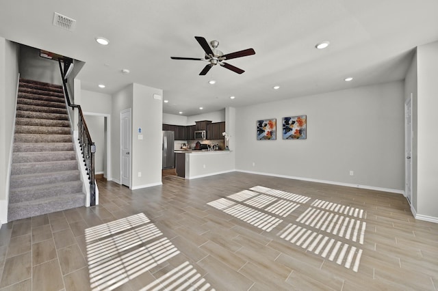 2867 Baneberry Ln, Mesquite, TX 75150 - unfurnished living room featuring stairway, ceiling fan, recessed lighting, baseboards, and wood tiled floors