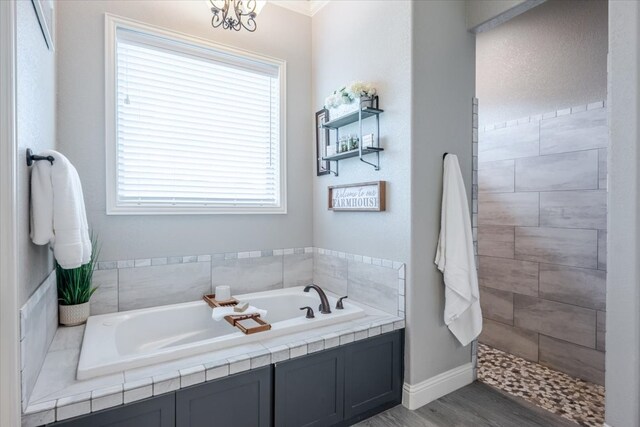 bathroom with crown molding, double vanity, ceiling fan, a chandelier, and baseboards