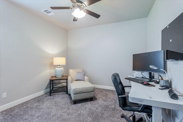 home office with a ceiling fan, carpet, and baseboards