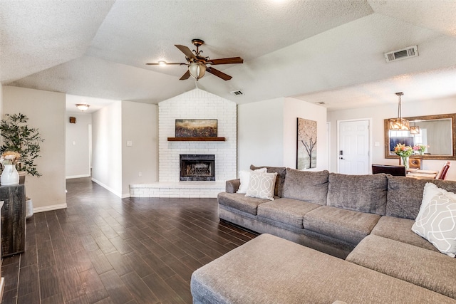 2802 Rio Grande Pass, Mesquite, TX 75150 - living room with a ceiling fan, vaulted ceiling, baseboards, dark wood-type flooring, and a chandelier