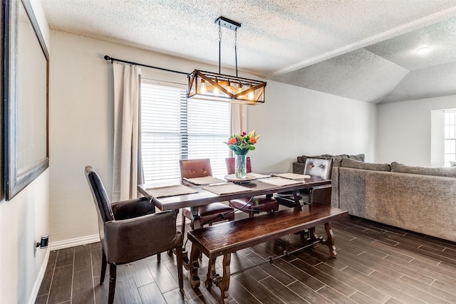 2802 Rio Grande Pass, Mesquite, TX 75150 - dining space with a chandelier, a textured ceiling, wood tiled floors, and baseboards