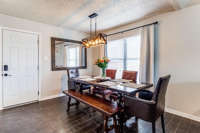 2802 Rio Grande Pass, Mesquite, TX 75150 - dining room with dark wood-type flooring, baseboards, a textured ceiling, and a chandelier