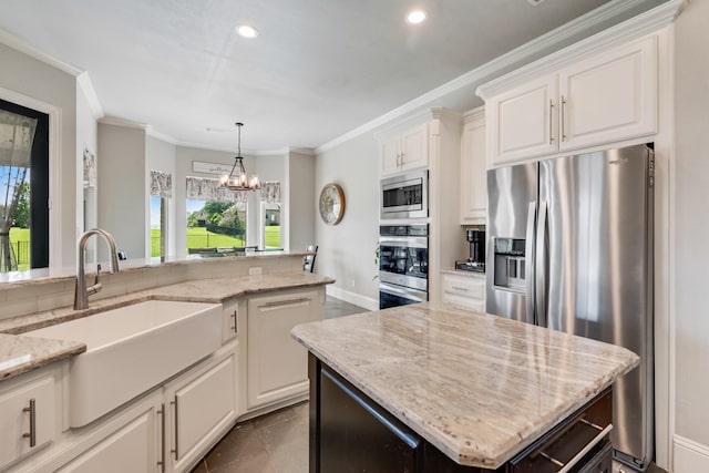 5 Maltese Cir, Heath, TX 75032 - kitchen featuring stainless steel appliances, a sink, crown molding, light stone counters, and a chandelier