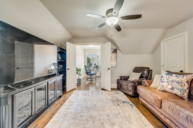 5 Maltese Cir, Heath, TX 75032 - living room featuring a desk, a ceiling fan, light wood-style flooring, vaulted ceiling, and baseboards