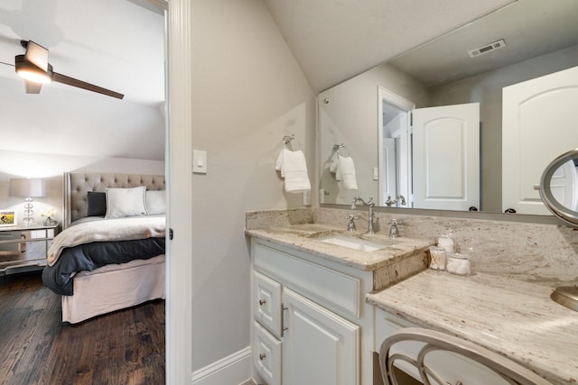 5 Maltese Cir, Heath, TX 75032 - bathroom with ensuite bathroom, wood finished floors, ceiling fan, vaulted ceiling, and vanity