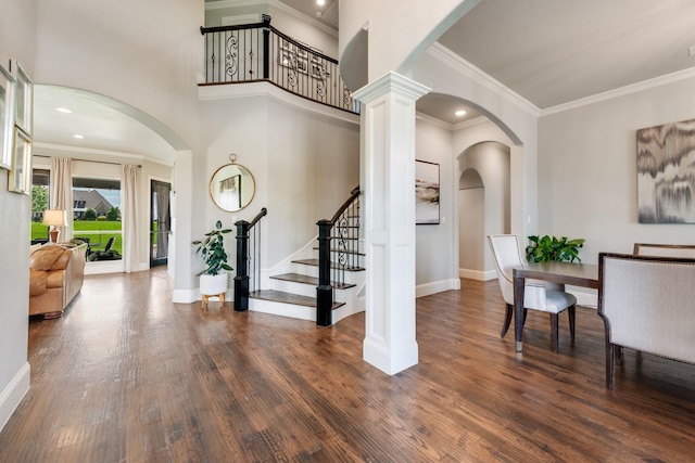 5 Maltese Cir, Heath, TX 75032 - foyer with ornamental molding, wood finished floors, stairs, arched walkways, and baseboards